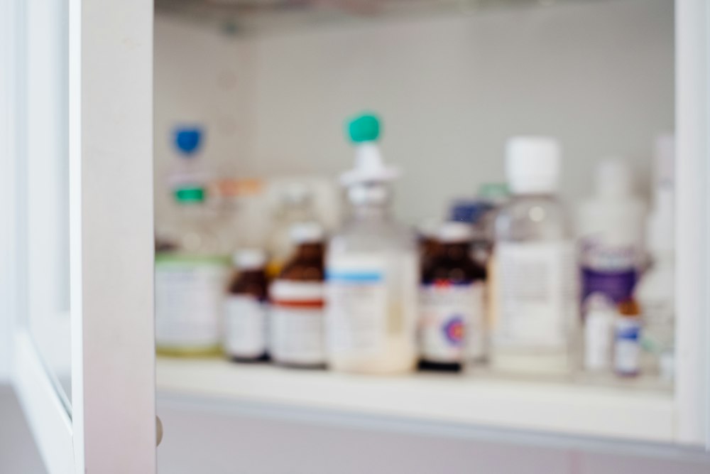 Dispensing bottles on a pharmacy shelf